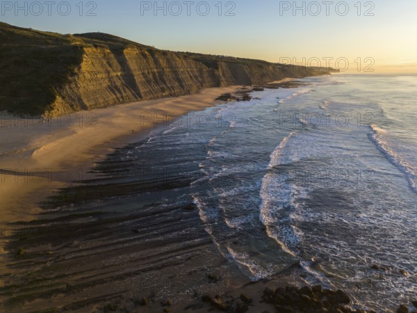 Magoito Beach and Cliffs at Sunset during Low Tide. Atlantic Ocean, Portugal. Golden Hour. Aerial View