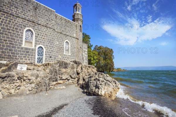 Church on the shore of the Sea of Galilee - Tabgha. High waves on the Sea of Galilee. Christian places of Israel. Ethnographic, historical, religious and photo tourism concept