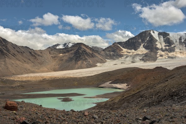 Mountain landscape with glaciers and lake near Elbrus on Caucasus, Russia, Europe