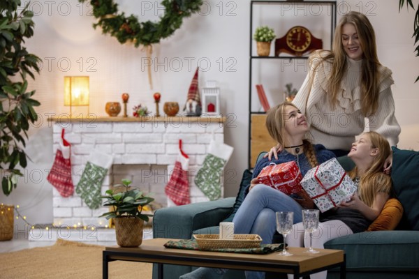 A heartwarming family scene of love, joy, and laughter as they celebrate Christmas together with gifts