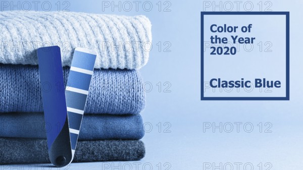Stack of sweaters and color fun palette in classic blue 2020 color. Color of year 2020 concept for fashion and clothing industry. Banner