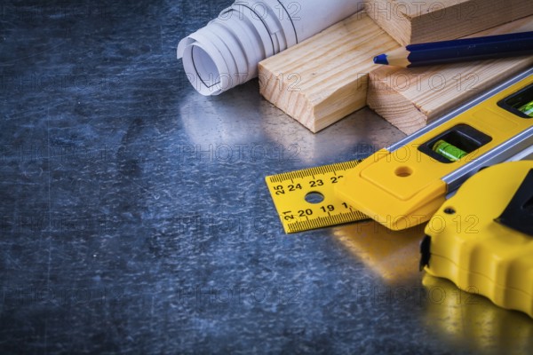Composition of construction working tools on metallic scratched background architecture and building concept