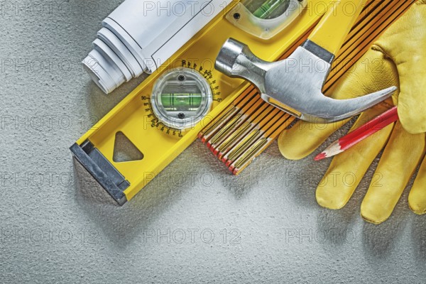 Collection of construction tools on concrete background building concept