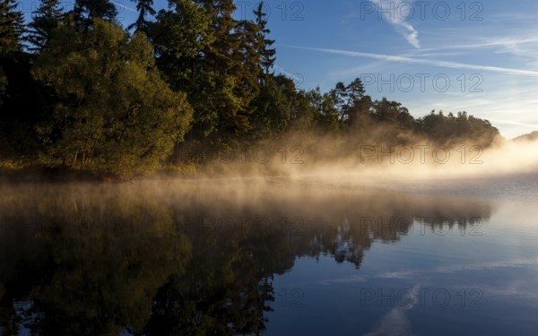 Lake with morning fog Light mood