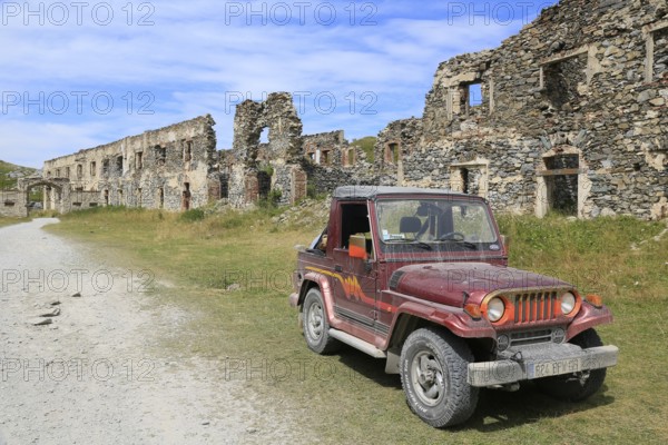 Asia Rocsta off-road vehicle in the ruins of the former barracks at Col de Tende, Alpes-Maritimes department, France, Italy, Europe