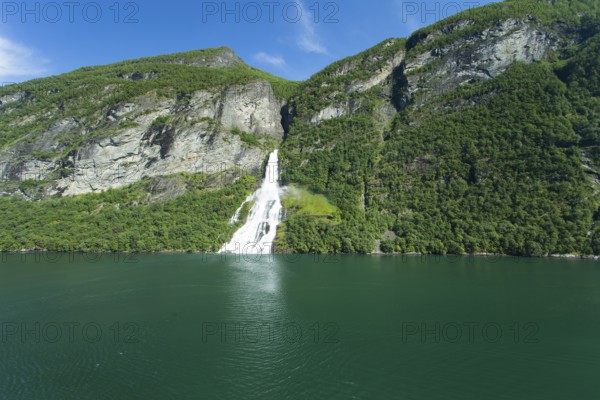 Image shows a waterfall in Geiranger ford in norway