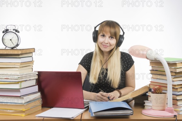 Student with headphones ready to pass the diploma project looked into the frame