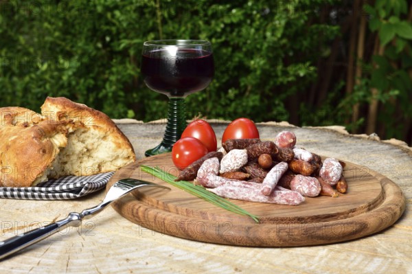 A picnic with salami and red wine