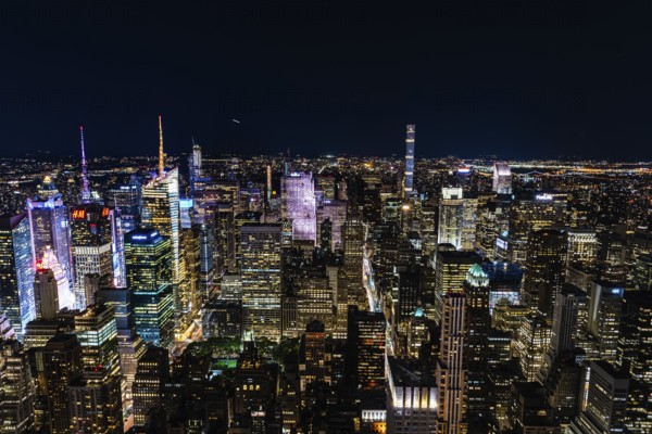 New York City, USA, June 25, 2018: High angle view of the skyline of Manhattan at night. Business, technology and travel backgrounds, North America