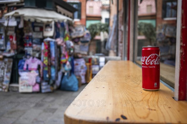 Coca Cola can on a wooden table, Venice, Italy, Europe