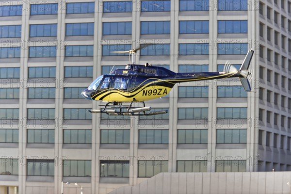Manhattan, Brooklyn, New York City, New York, USA, North America, Helicopter flies close to modern building facade, North America
