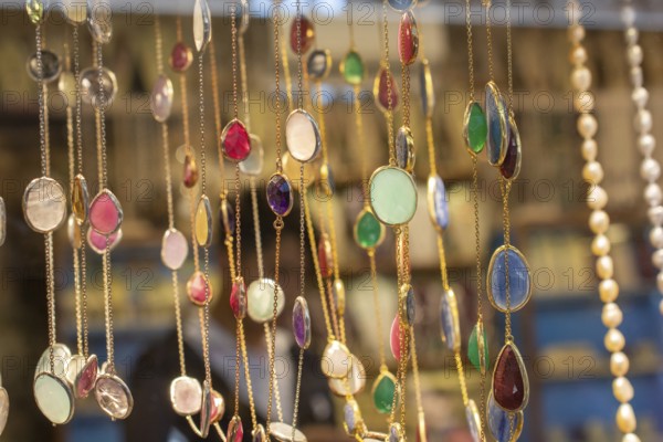 Handcrafted necklace. String of beads in various colors. Colorful beads necklaces