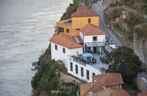 Porto, Portugal, October 25 2018: Tourist people on a coffee shop at o Rebiera the old town of Porto city in Portugal Europe, Europe