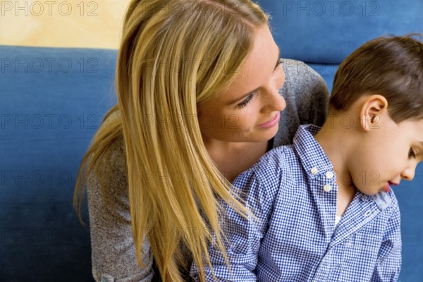 Mother and son, symbol of motherly love, family, conflict