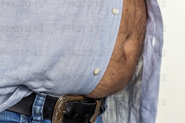 Man with excess weight. Symbolic photo of a beer belly, unsuccessful diets and poor nutrition. Austria