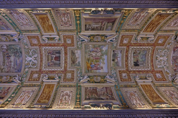 Ornate ceiling featuring detailed frescoes with classical art elements, Galleria delle Carte Geografiche, Rome, Lazio, Italy, Europe