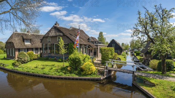 Giethoorn Netherlands, panorama city skyline at canal and traditional house in Giethoorn village