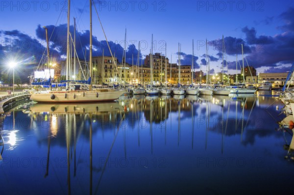 Idyllic view on Sailboats in harbor of Palermo -blue time in the city. Wonderful cloudscape