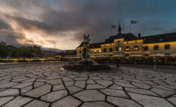 Uppsala, Uppland, Sweden, 07 27 2019 Facade of the Railway station and the square by night, Europe