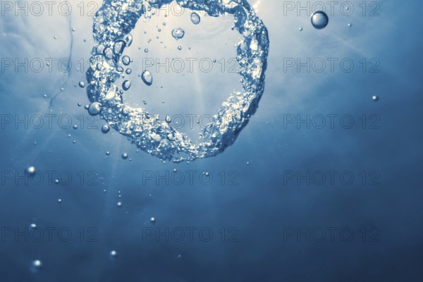 Bubble ring Underwater ascends towards the sun