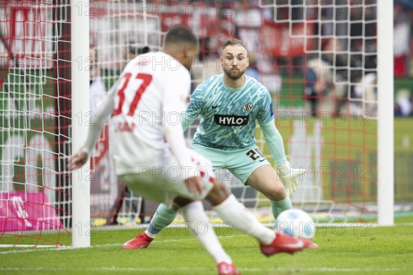 (DFL/DFB REGULATES PROHIBIT ANY USE OF PHOTOGRAPHS AS IMAGE SEQUENCES AND/OR QUASI-VIDEO), RheinEnergieStadion, Cologne, North Rhine-Westphalia, Linton Maina (1.FC Köln, Midfield, #37), Nicolas Kristof (SV 07 Elversberg, Goalkeeper, #20), 2nd Bundesliga, 1.FC Köln, SV 07 Elversberg on 25.01.2025 at RheinEnergieStadion in Cologne Germany