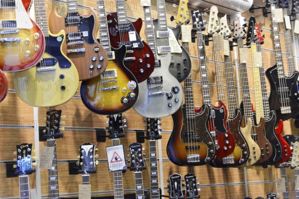 A music shop with a variety of hanging electric guitars in different designs, Istanbul, Istanbul Province, Turkey, Asia