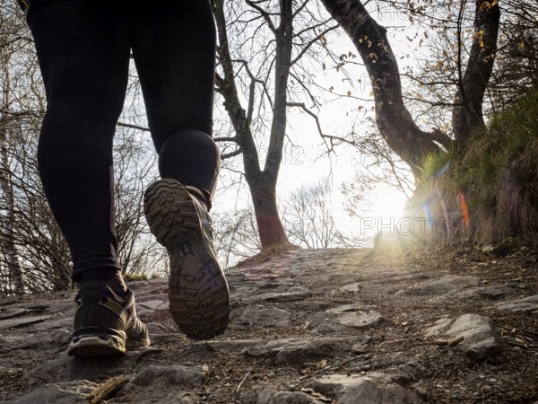 Walking scene on a mountain trail at sunset
