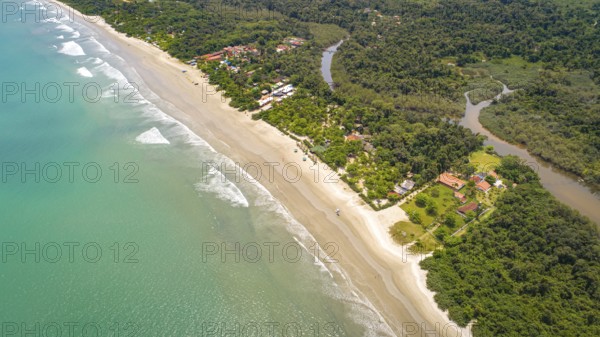 Close-up aerial view of a Green Coast beach with turquoise water, meandering river and forest, Brazil, South America