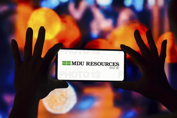 In this photo illustration, the MDU Resources Group logo is displayed on a smartphone screen