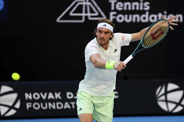 MELBOURNE, AUSTRALIA, JANUARY 11: Stefanos Tsitsipas of Greece plays against Novak Djokovic of Serbia during a charity match ahead of the 2024 Australian Open at Melbourne Park on January 11, 2024 in Melbourne, Australia, Oceania