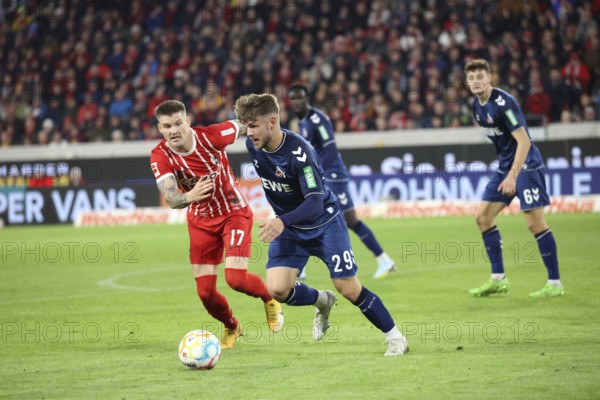 Running duel against# Lukas Kübler (Freiburg) and Jan Thielmann (1. FC Köln) at the match of the 1st FBL: 22-23: 13. Sptg. SC Freiburg, 1. FC Köln DFL REGULATES PROHIBIT ANY USE OF PHOTOGRAPHS AS IMAGE SEQUENCES AND/OR QUASI-VIDEOn Photo: Joachim Hahne/johapress