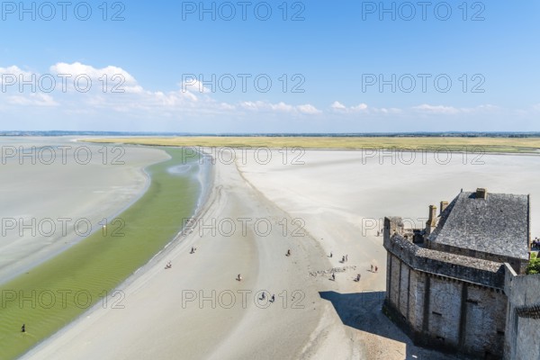 Mont Saint Michel, France, July 25, 2018: View of the bay of Mont Saint Michel from the ramparts at low tide, Europe