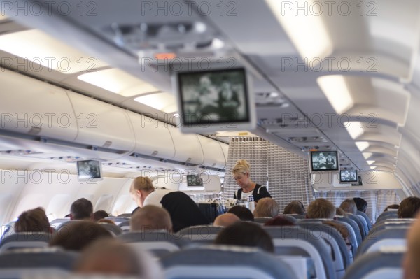 10.06.2016, Helsinki, Finland, Europe, Flight attendants serve passengers on a flight to Helsinki. Finnair is a member of the One World Airline Alliance, Europe
