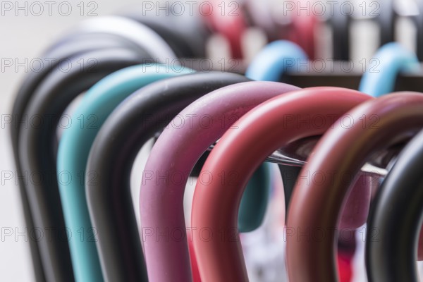 Colourful handles of parasols and umbrellas - close-up