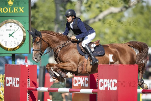 Columbian rider Juan Manuel Gallego riding Fee Des Sequoias Z competes in the second round and jumpoff of the CPKC International GP at Spruce Meadows Masters, in Calgary, Alberta, Canada, North America