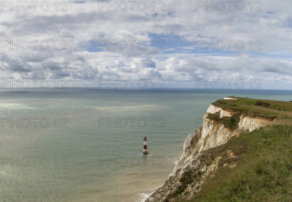 View of the Beachy Head Lighthouse in the English Channel and the white cliffs of the Jurassic Coast