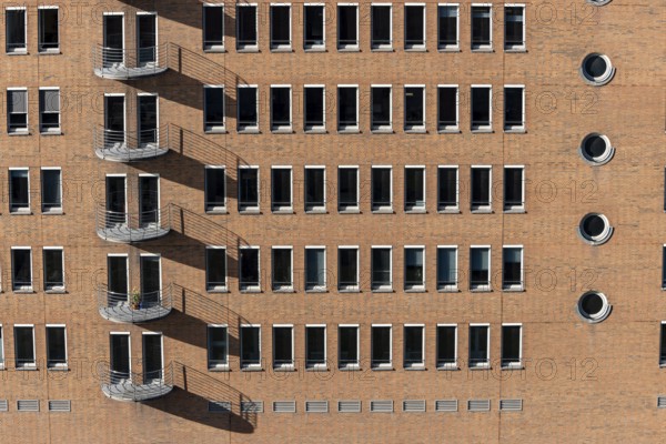 Red brick building with balconies and square and round windows in the Speicherstadt, Hafencity, Hanseatic City of Hamburg, Hamburg, Germany, Europe