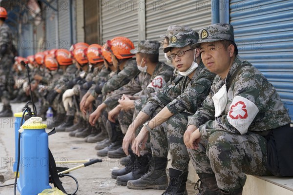 Rescue personnel resting, nepal, asia