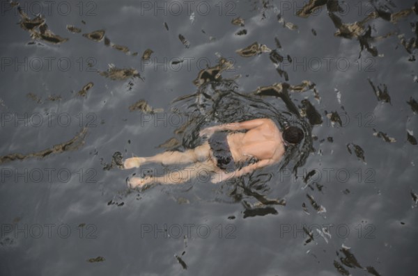 Man swimming in stepwell, jodhpur, rajasthan, India, Asia