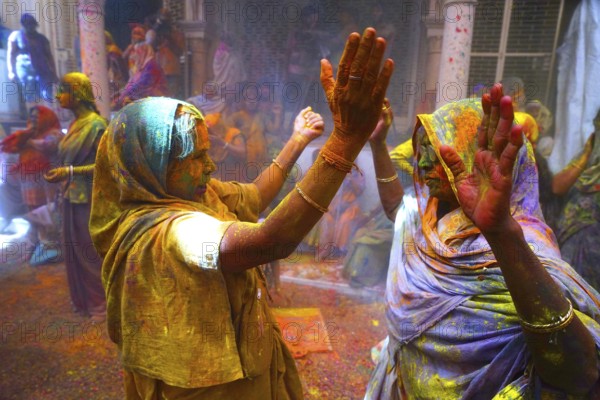 Widows celebrating Holi festival Gopinath temple, Uttar Pradesh, India, Asia