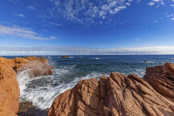 Coastal landscape with red rocks and surf in blue sky and sunshine, Spiaggia di Cala E'Luas, Ogliastra, Sardinia, Italy, Europe