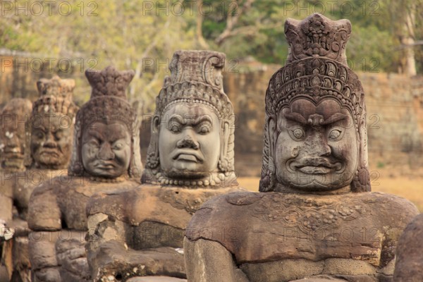 Balustrade with stone gods and demons on the bridge to the southern Tor tor of Angkor Thom
