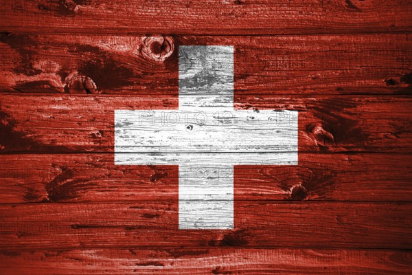 Switzerland flag on wooden planks background wood flag