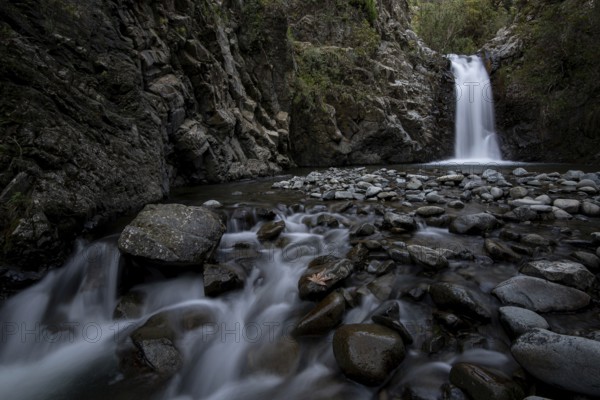 Waterfall splashing and flowing through stones on the river. Machairas forest Troodos mountains Cyprus