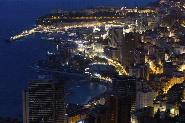 Monte Carlo panorama illuminated by night. Urban landscape with luxury architecture