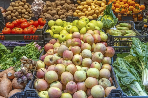 Apples and vegetables for sale at a market