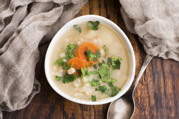 Barley soup, pearl barley in white bowl