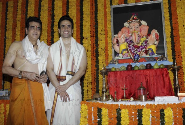 Bollywood actor Jeetendra with his son and actor Tusshar Kapoor during the Ganesh Chaturthi celebrations in Mumbai