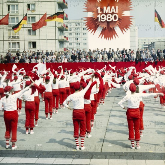 198005010100, East Berlin, 01.05.1980, Karl-Marx-Allee, sportswomen with scarves during a demonstration in front of the honour stage at the May Day demonstration East Berlin, GDR GDR
