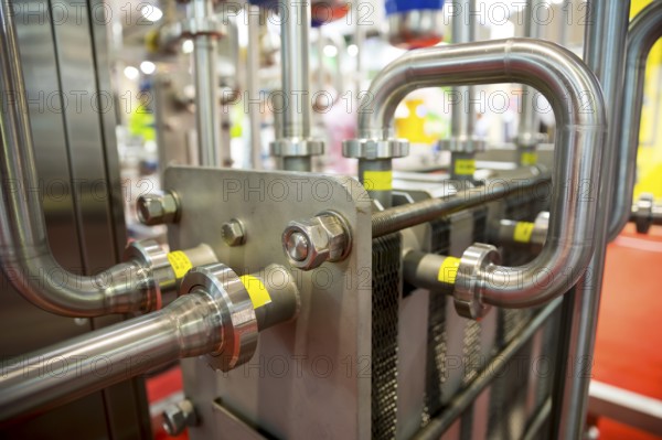 Milk pasteurization system is shown at a food and drink exhibition. Heat Treatments. Pasteurization is a process that kills microbes in food and drink, such as milk, juice, canned food, and others